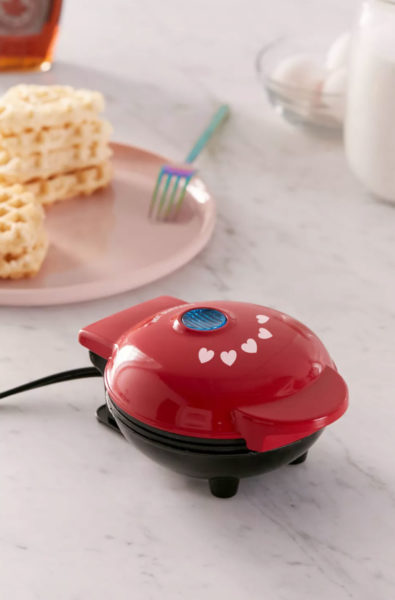 Mini heart waffle maker in red.
